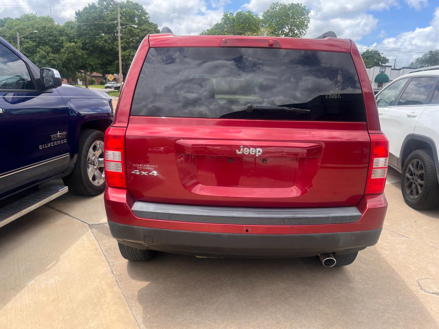 2014 RED JEEP PATRIOT SPORT Sport 4WD (1C4NJRBB9ED) with an 2.4L L4 DOHC 16V engine, located at 8101 E. Skelly Dr., Tulsa, OK, 74129, (918) 592-3593, 36.121891, -95.888802 - Photo#2